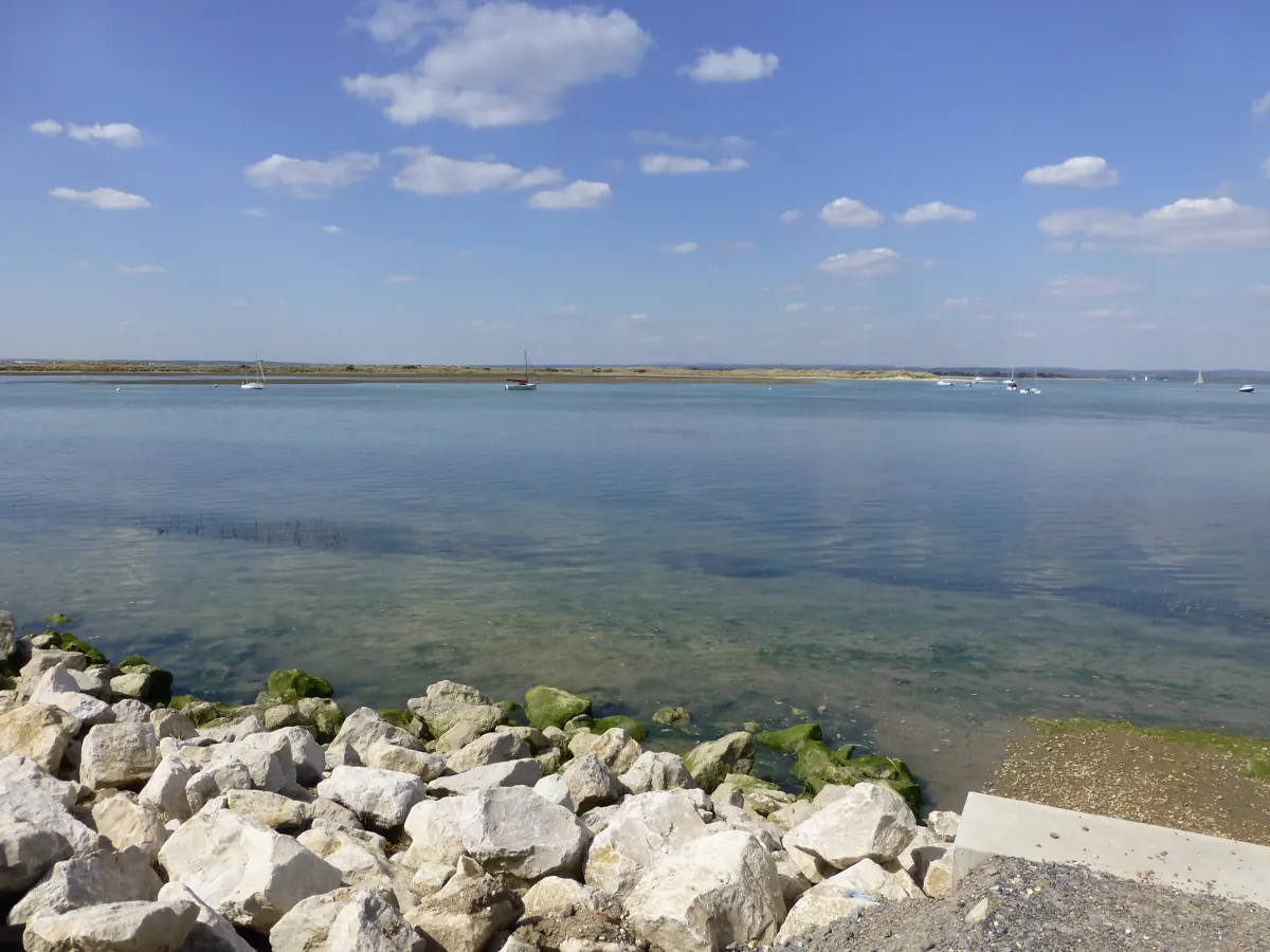 The water's edge seen from the rebuilt sea defences at West Wittering, looking towards East Head